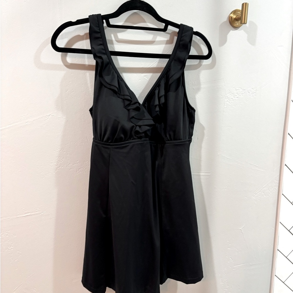 Women’s black swim dress. Great condition.